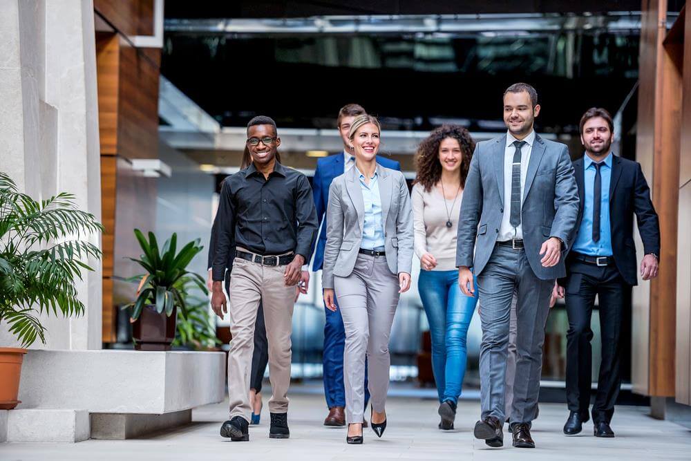 Group of a young business people discussing business plan.