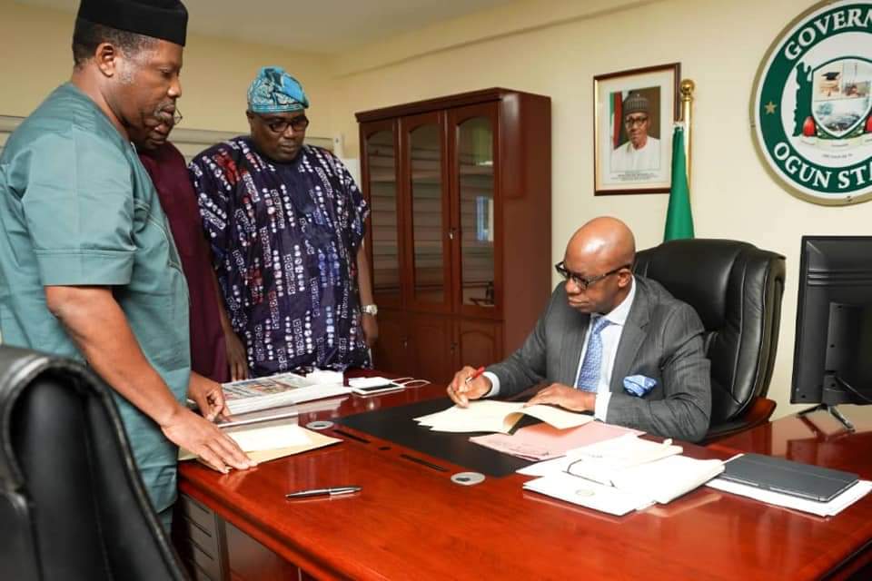 ABIODUN SIGN SECURITY TRUST FUND, OGROMA BILLS INTO LAW