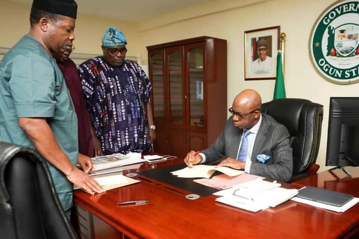 ABIODUN SIGN SECURITY TRUST FUND, OGROMA BILLS INTO LAW