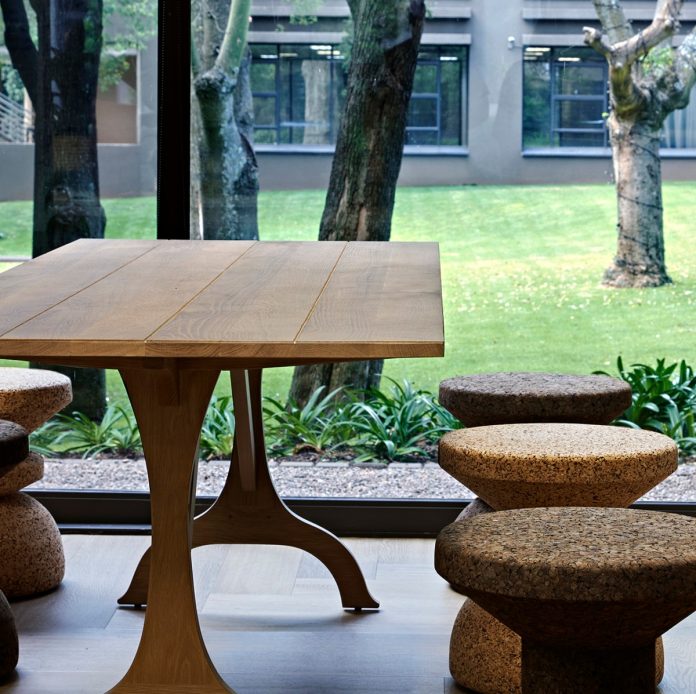 Oppenheimer Memorial Trust cork stools alongside a custom made timber table